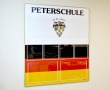 Стенд для гимназии Peterschule, 1000 х 1200 мм, аналог профиля Nielsen, полноцветная печать, карманы: 8 А4, 2 А3. Стоимость 9810 рублей.