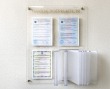 Стенд из акрила 600 х 800 мм на 4 дистанционных держателях, 3 кармана из акрила на заклепках, 1 перекидное устройство на 10 рамок. Стоимость 10790 рублей.